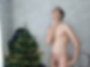 Naked by the Christmas tree